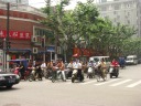Along with cars, one sees many bicycles, scooters, and the occasional 
load-carrying trishaw.

