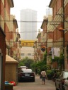 Another style of lilong buildings, at 579 Yuyuan Road.  Although 
buildings are more austere, there are more plants along the alley.

