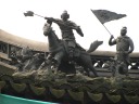 An excellent picture of little sculpture on a roof.

