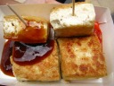 Stinky tofu.  Oddly (and unusual for stinky tofu), the tofu itself
didn't smell.  Fried outside, soft inside, and tasted good
(surprisingly).  Bares little resemblance to the stinky tofu I
had in San Francisco.

