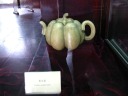 A pumpkin-shaped teapot.

