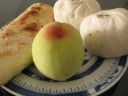 Breakfast: steamed buns, roasted sesame bread, and a peach we picked 
from a tree on Three Hill Island on Lake Tai.
