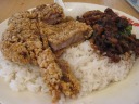 Deep-fried pork on rice, though the pork was of questionable quality.

