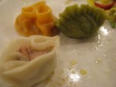 Top-left (orange): beef with pepper and vinegar.
Top-right (green): chicken.  Straight-up like U.S. dim sum. 
Bottom-left: ham and corn.


