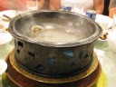 A pot of mini dumplings containing chicken.  When boiling, it looks as 
if the dumplings are swimming.  Because they're small, it's hard to tell 
how many dumplings you get when you ladle yourself some soup.  The 
number you get is supposed to tell your fortune.  I got two, which means 
"double happy."


