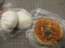 My lunch: a spicy pork bun, a bok choy and tofu bun, and bread stuffed 
with greens.  The last was oily from the filling; the bread itself 
didn't taste fried (though it likely was).  I also ate a bun (not 
pictured) of (I think) dried vegetable and meat in plum sauce.

