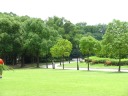 A typical example of the park's manicured lawns.  In the distance, 
there's a bridge over a creek.   In addition to the statues and 
lawns, the park also has many fountains, none of which I photographed.

