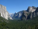Peering into Yosemite Valley from a vista point on the highway on the
way out.  El Capitan is on the left, and Half Dome is in the distance. 
 Sentinel Dome (our morning hike) was somewhere in the vicinity of
the bald dome at the top of the mountain that slightly obstructs the
view of Half Dome.  (That is, the dome in the distance about two-thirds
of the way to the right in the photo.)  I'm not sure if it's Sentinel
Dome or Taft Dome in this picture.
