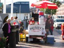 A hot dog stand with a cute sign.

