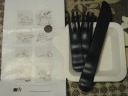 Amusing cartoons that came with the cake about different ways to eat a 
cake, plus some unusual forks.
