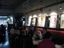 The other side of the restaurant, with maps of France and old (movie?) 
posters.

