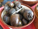 Snails.  The liquid (barely visible at the bottom of the bowl, but it
resided within each shell as well) infused them with some heat/spiciness.  
However, I wasn't into them.

