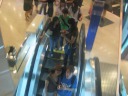 Self-portraits, taken using the reflective underside of an escalator.

