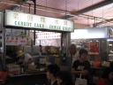 A stand with a little old man who puts all his attention and strength into 
making his dishes.

