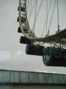 The flyer pods on the ferris wheel rising away from us.
