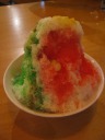 Ice kaching.  Shaved ice on top of red beans, green jelly, and weird 
mostly-solid jelly-bean-shaped things, and topped with corn.
