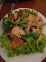 "Fried pork with cashew nut, tomato, and onion."

