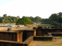 A panoramic movie taken from the top of the Terrace of the Leper King.  It 
first looks south toward the Elephant Terrace, then swings east toward the 
former prisons (these are easy to miss because they match the color of the 
ground), then continues until it looks north.  The main purpose of the 
video is to show the landscape of this part of Angkor.  I like how things 
glow in the late afternoon sun.

Although I intended to show the lotus-shaped fountain at the beginning of 
the video, it's too small and I can't make it out.
