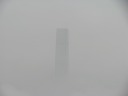 You know the top of the International Financial Center Two (IFC2) that I
previously
lost in the clouds?  Well, I found it peeking out of the fog.
