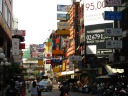 Back closer to downtown.  With all the signs sticking out into the street,
it reminds me a bit of Hong Kong.
