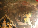 A scene from one of the murals running along the perimeter of the temple 
complex.  The murals depict mythical scenes from the Ramakien.  There 
are hundreds of meters of murals -- they just go on and on.  They're 
creative and varied.
