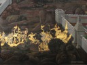 A battle outside a castle.  Wow that archer can shoot arrows very fast!
