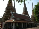 Huge stupa towers loom above an open-air pavilion.  Despite their size, 
they're not less intricate than the smaller ones.  Excellent?
