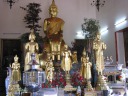 An array of Buddhist statues in another temple in the complex.
