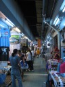 Another sample corridor of shops at the night market.  Note the
t-shirt at left: "YouTube myspace and I'll Google your Yahoo."
