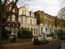My side of the street has a bit more diverse architecture.  I took 
this picture on November 10, 2010.
