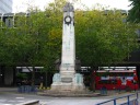 A memorial honoring war dead is in the middle of a roundabout.  This 
roundabout is on a road (leading to a bus station) that divides Euston 
Square park in half.
