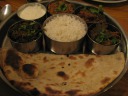 Vegetable thali: a selection of vegetarian dishes (spinach, okra, dal, 
and something else I forget), accompanied by raita, rice, and roti.  Di 
Yin loved the okra.
