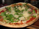 A pizza of mozzarella, tomato sauce, rocket (arugula), parma ham, and 
parmesan shavings.  Quite good.  Parma ham makes anything delicious.
