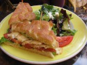 "Monterey Bay sand dab, lemon remoulade, lettuce & tomato on focaccia." 
The salad was topped with a balsamic vinaigrette and feta cheese.
