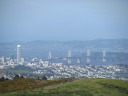 Using an 8x zoom, one can see the bay bridge leading to Yerba Buena 
Island / Treasure Island, with the Berkeley hills in the background.
