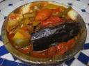 Our tajine, served in a plate too hot for us to touch but brought to us 
by a waiter with his bare hands.  We got two types of tajine: meat in 
eggplant and also cabbage with green beans, peas, and carrots.  Both 
were served over couscous.  Both were fine and unremarkable.
