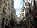 The western end of the passage deposits you on Rue Marie-Stuart, which 
is still fairly lovely.  Notice the planters on the balconies on the 
right.
