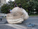 The giant head in the plaza in from the Saint Eustache is used as a 
jungle gym by kids.
