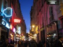 Rue da la Huchette in the Latin Quarter.  It has lots of Greek 
restaurants.  Some have a pile of broken ceramics in front--they break 
plates when someone enters.
