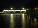 Pont Marie bridge.  People still sit by the Seine at night (look to 
the right).   Also, when we passed the Seine earlier at night 
(just after dark), we saw people having a picnic on the footpaths, 
wine and all.

