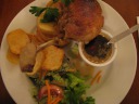 We returned for the third time to Les Philosophes for dinner (first 
visit, second visit).  
This picture is of my "la vrai cuisse de canard maigre confit."  The 
fried duck leg was quite good, with nice skin skin and moist interior.  
I didn't touch the super-thick/sweet honey sauce.  The potato wedges 
tasted like french fries, though perhaps pushed slightly in the 
direction of roasted potatoes.  The salad, with its honey mustard 
dressing, was good as well.
