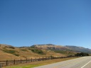 The non-coast side of the road here consists of rolling brown hills.  
It's definitely a different micro-climate than the cooler, foggy, green, 
brushy, mountainous terrain elsewhere.
