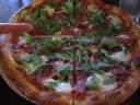 My smoked duck pizza with buffalo mozzarella, one of the day's specials.  
It was good.  The duck was nicely smoked.  It didn't taste particularly 
like duck but then didn't taste much like any other meat either.  
Fundamentally, the dough was tasty, and that's the key to making a good 
pizza.

My finger is in the picture to show how large the pizza was.
