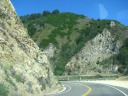 This part of highway 1 in Big Sur curves around steep, stone 
mountain-sides.
