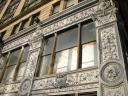 The ornate facade of a huge building that became a Forever 21 store.  
Quite intricate.  Soon after I took this picture they painted it as part 
of the renovations before it opened.  I also can pass this building 
on the way to work.

