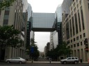 An unusual multi-story glass bridge linking two buildings.  This 
crosses Techworld Plaza near Mount Vernon Square.  For reference, the 
plaza would be 8th Street NW if it were open to cars.  In the distance 
is the American Art Museum / National Portrait Gallery.
