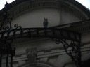 Inside one of the driveways' arches perches a wooden owl.
