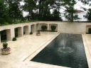 The sunken courtyard with its fountain/pool adjacent to the patio.

