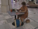 Woman Eating by Duane Hanson is a detailed sculpture of a real 
day in an unglamorous life.
