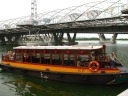 My bumboat as I was about to board it, with the helix bridge in the 
background.
